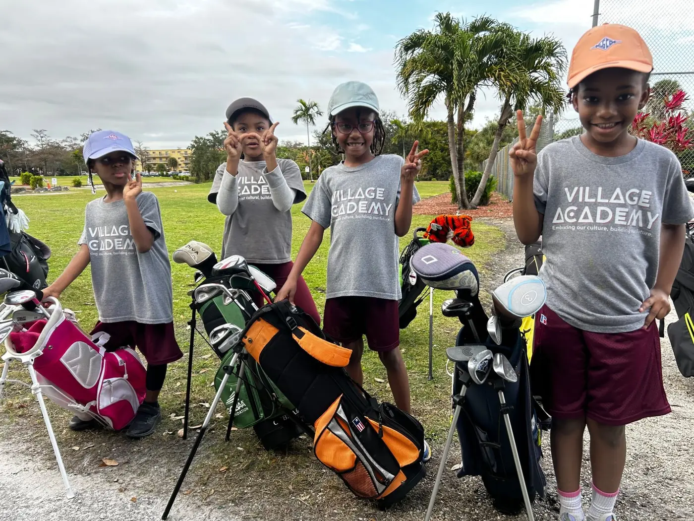 Village Academy students participating in a golf experience