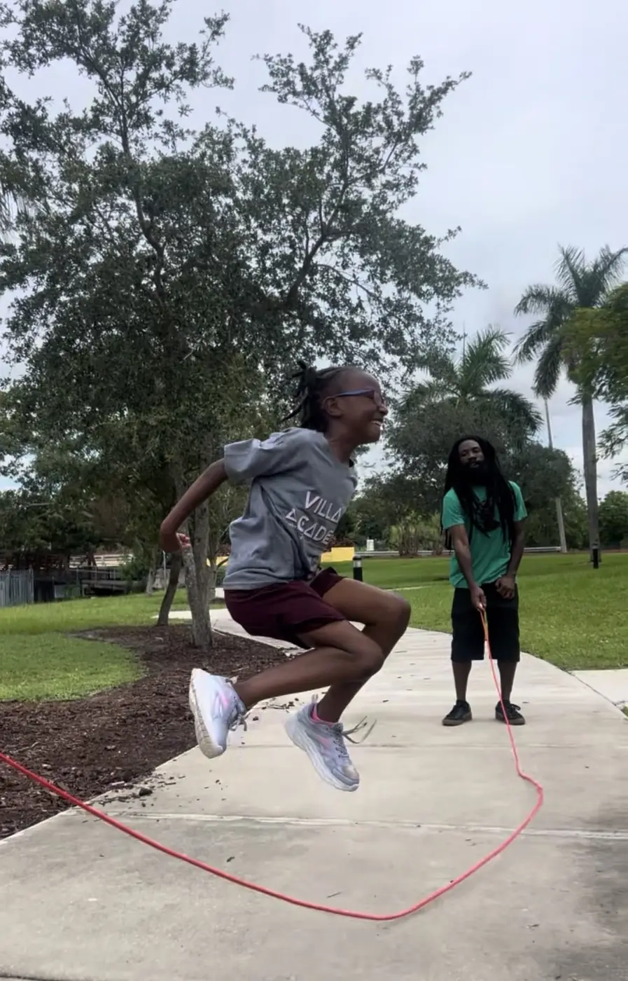 Village Academy student jumping rope outdoors