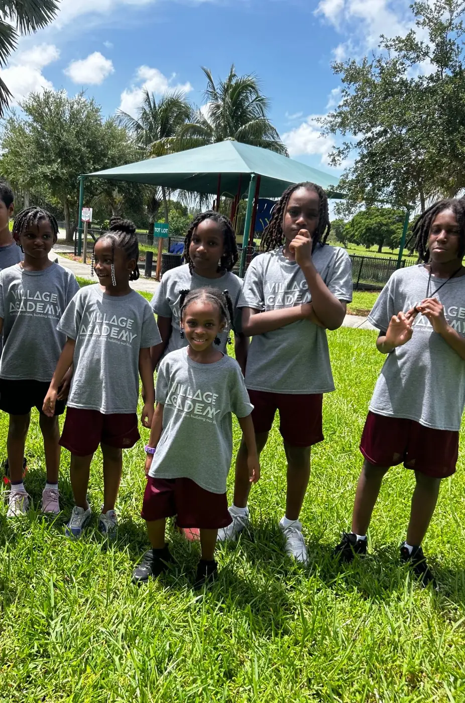 Village Academy students gathered outdoors in school shirts