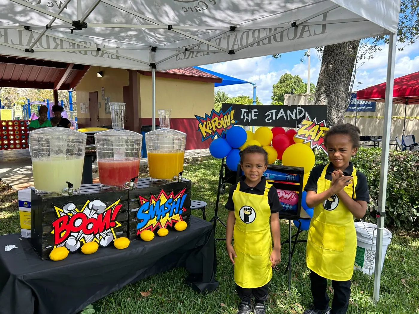 Village Academy students operating The Stand at a community event