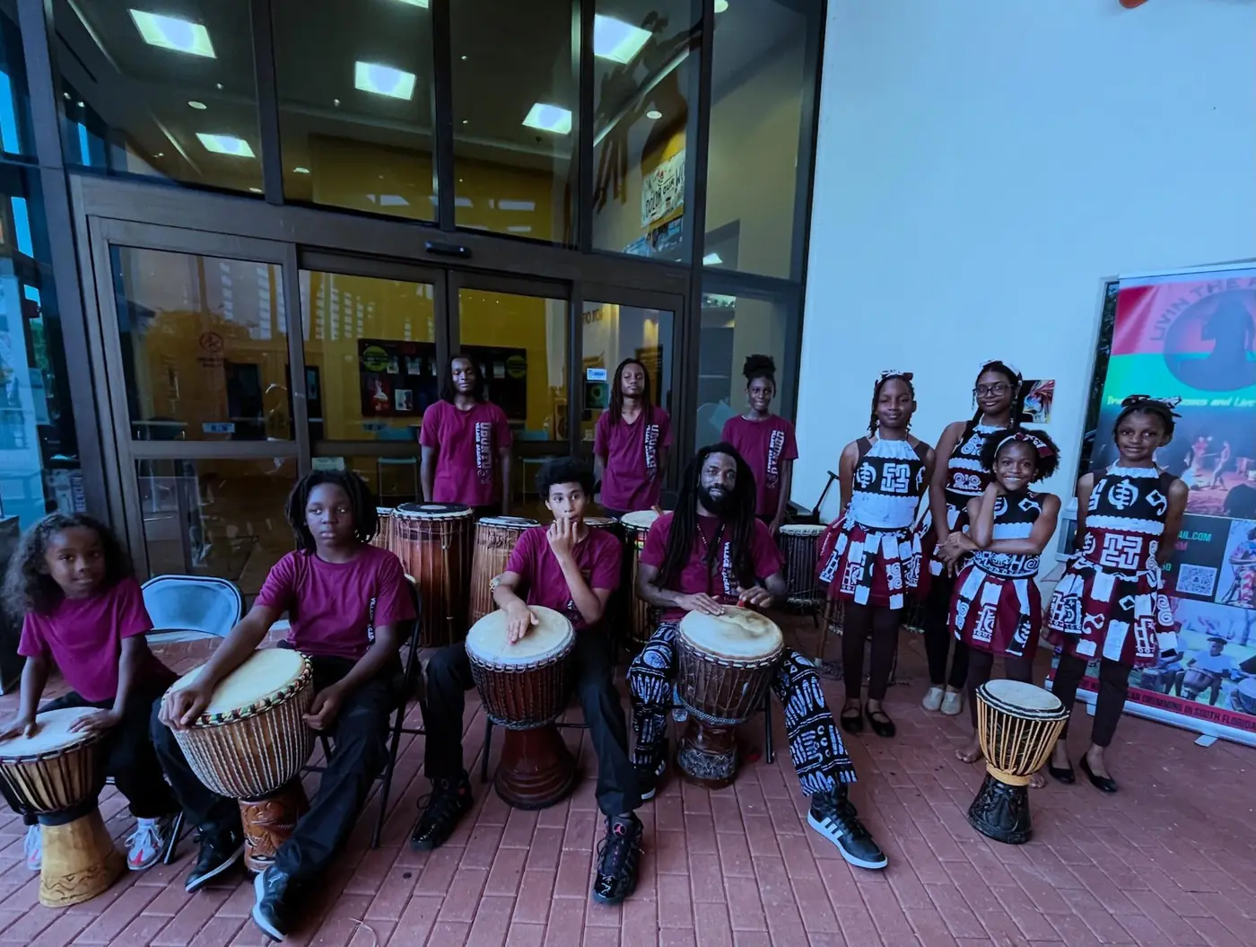 Village Academy students participating in a drum performance